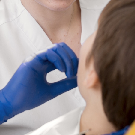 Invisalign First 12 dentist-cleaning-child-s-teeth
