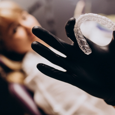 Invisalign First 13 Woman patient visiting dentist